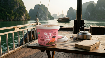 Vegetarian Vietnamese chay dishes on a table with a Spice Up ready to eat meal packed for travel