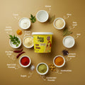 Spice Up Kadi Chawal packaging surrounded by ingredients on a brown background