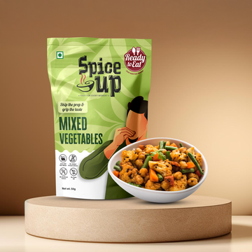 Spice Up mixed vegetables package with a bowl of prepared food on a beige background