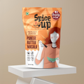 Spice Up Paneer Butter Masala packaging on a white platform with a beige background
